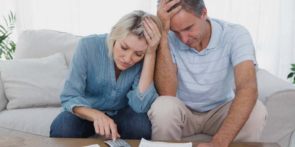 couple going over bills and worried about finances